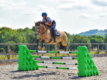 Load image into Gallery viewer, Horse and rider jumping over a pair of Eco Green Combi Blocks with 4 9 Band Practice Poles. 
