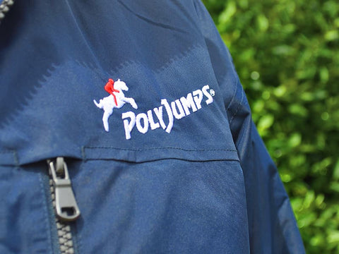 Close up of PolyJumps Logo sewn into left chest of jacket