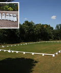 Photograph of Dressage Arena, 20 by 40 metres in field, complete with Dressage Tower Markers. Option includes 8 Dressage Tower Markers.