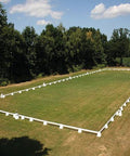 Photograph of Dressage Arena, 20 by 60 metres in field, complete with Dressage Tower Markers.