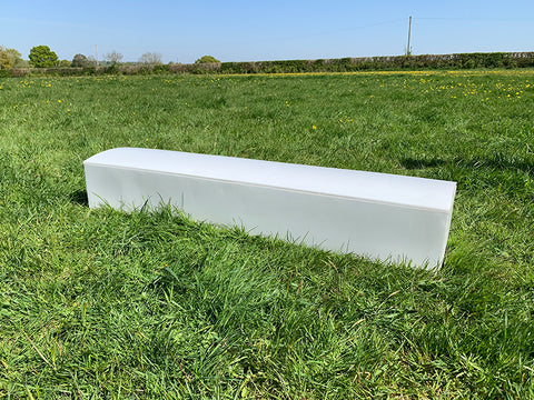 White Bridge Filler Extension piece sitting in grass.