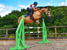 Load image into Gallery viewer, Horse and rider jumping over a pair of Eco Green Cross Wings with 2 9 Band Practice Poles. 
