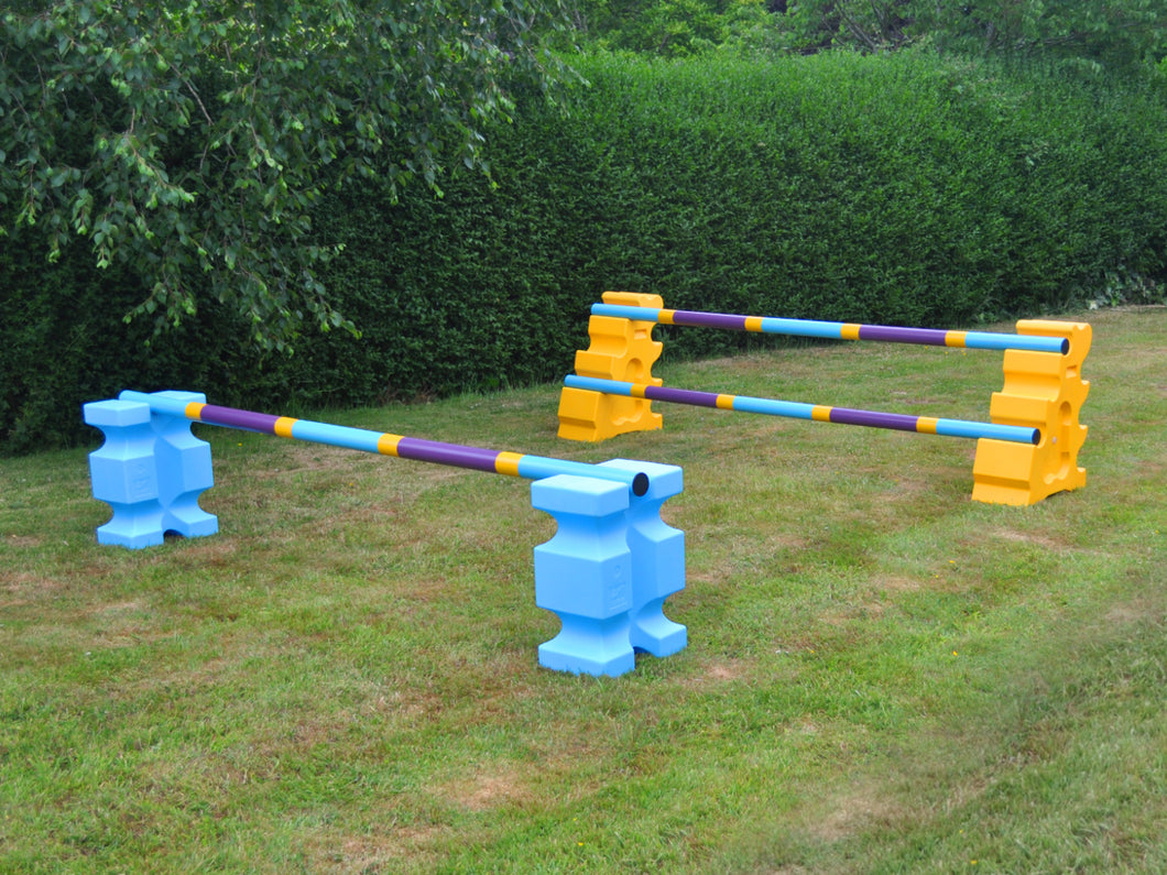 2 fences, from left to right. Pair of Baby Blue PolyJump Blocks with 1 9 Band Practice Poles Club Style. 1 Pair of Yellow MultiJumps with 2 Club Style Poles. 