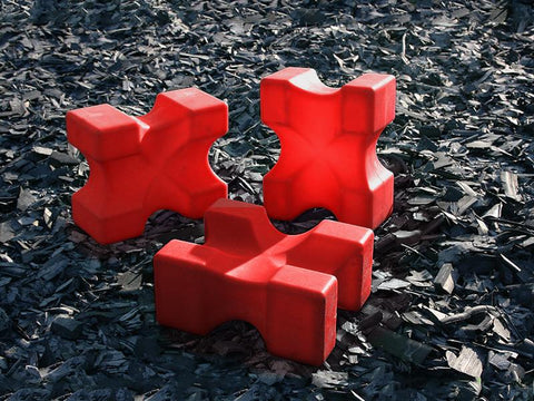 3 Red Mini Blocks sitting in arena. All on different edges to show various heights. 
