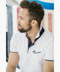Model wearing White Poloshirt, raised collar revealing Navy Blue contrast fabric. PolyJumps Logo on wearer's left chest.