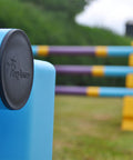 Close up photograph of the end cap on a practice pole. PolyJump Logo embossed onto the cap.
