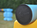 Close up photograph of the end cap on a practice pole. PolyJump Logo embossed onto the cap.