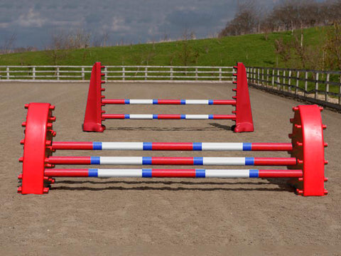 A pair of Red Hedgehogs with 3 Pro Poles 9 Band coloured: Red, Blue & White. Behind them is a pair of Red 8 Cups with 2 poles in an arena.