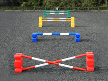 Load image into Gallery viewer, 4 rows of jumps. From front to back is a red pair of PolyJump Blocks with 2 5 band red and white poles. Behind that fence is the same in blue. Then a pair of yellow MultiJumps with 2 yellow and white 5 band poles. Finally a pair of green MultiJumps with green and white poles. 
