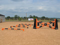 4 rows of Mini Blocks alternating orange and black with orange and black 7 Band Pro Poles. Black and orange 8 Cups with matching 7 Band Pro Poles, with black Hedgehogs behind with 2 more 7 band Pro Poles.