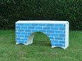 Photograph of a White Bridge Filler with a Blue Brick graphic. 